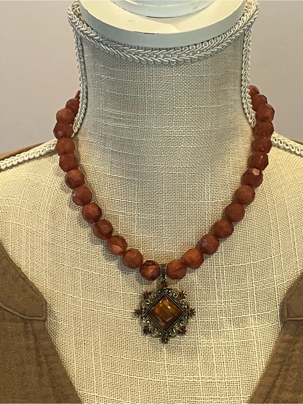 Faceted Bead Necklace with Ornate Brown Stone Pendant